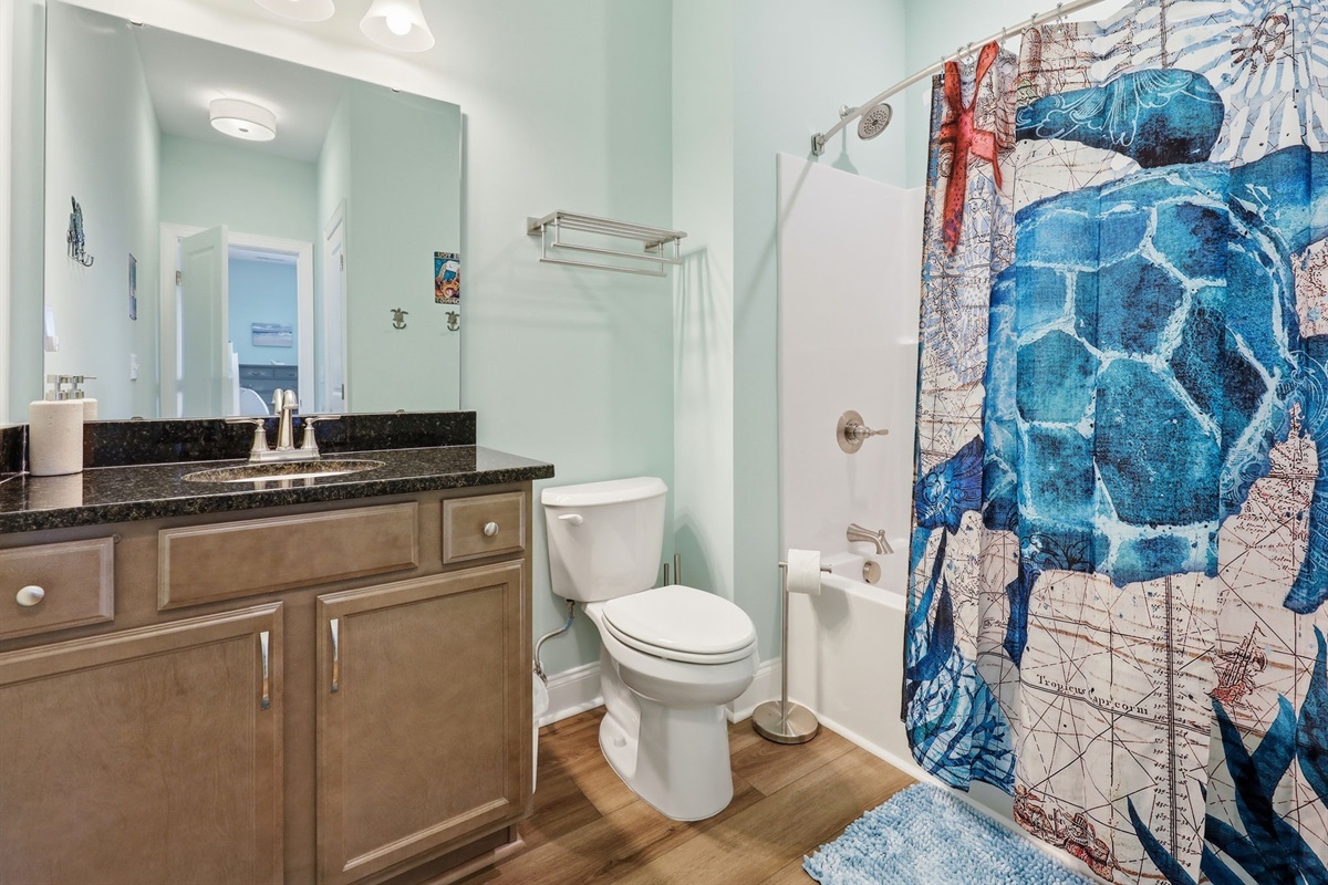 Ensuite master bathroom with full tub and shower setup