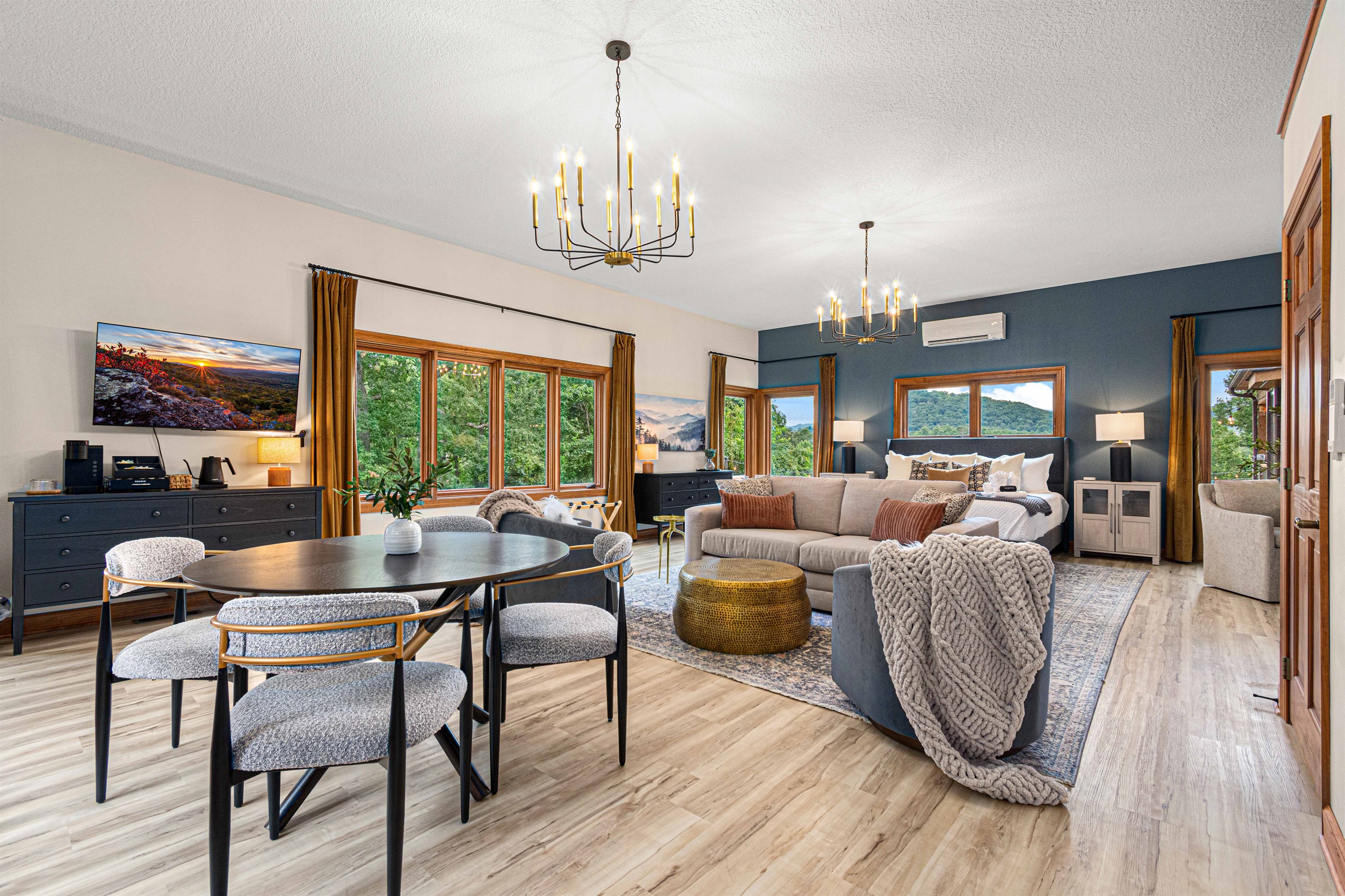 The Blue Ridge Suite doubles as its own retreat—featuring a king bed, lounge seating, and even a private dining nook, all surrounded by windows framing the mountain views.🛏️✨🌄