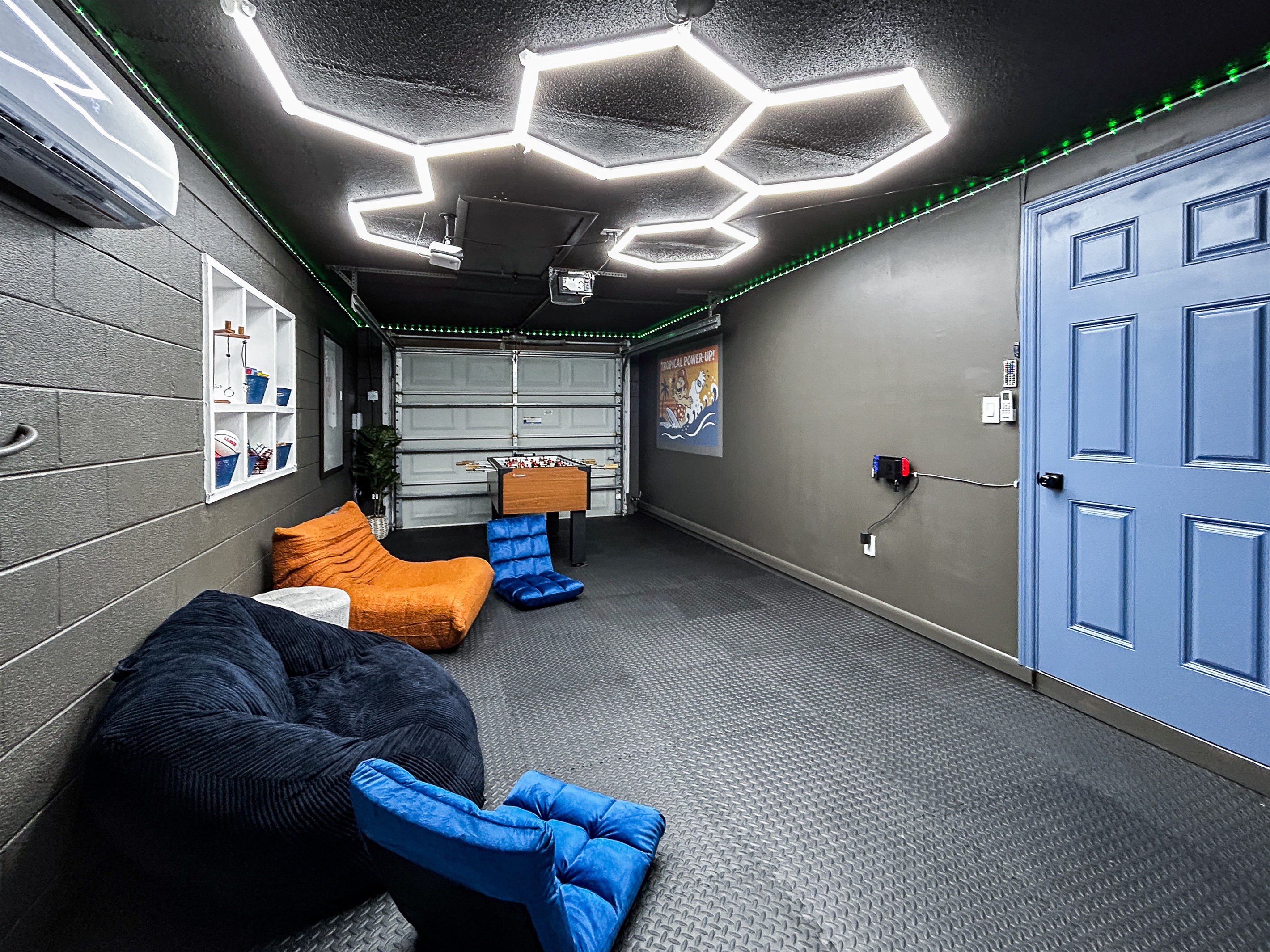 Garage Game Room Air Conditioned with Foosball, Nintendo Switch with Mario Kart, Just Dance & more. Comfortable Seating, Foam Mat Flooring, LED Lights, Mini Basketball, Games, Books & More