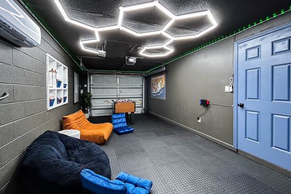 Garage Game Room Air Conditioned with Foosball, Nintendo Switch with Mario Kart, Just Dance & more. Comfortable Seating, Foam Mat Flooring, LED Lights, Mini Basketball, Games, Books & More