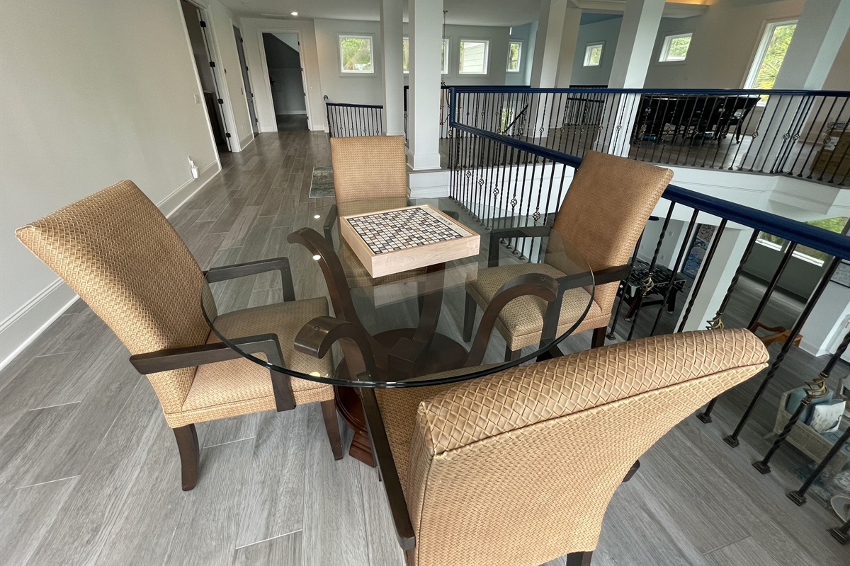 2nd game table w/luxury Scrabble & Monopoly boards. Can you spell “Game Night”?