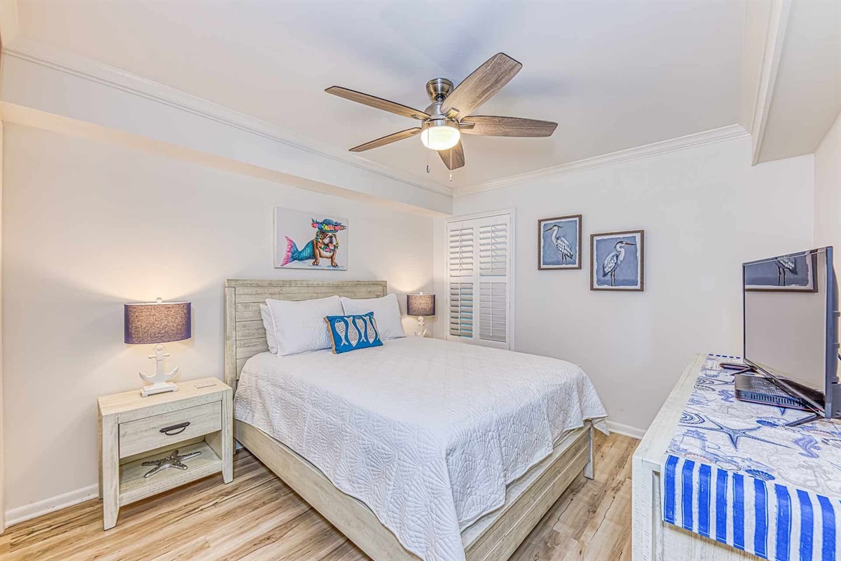 Bedroom Oasis: Bright ambiance with beachy decor, perfect for relaxation after a day in the sun!
