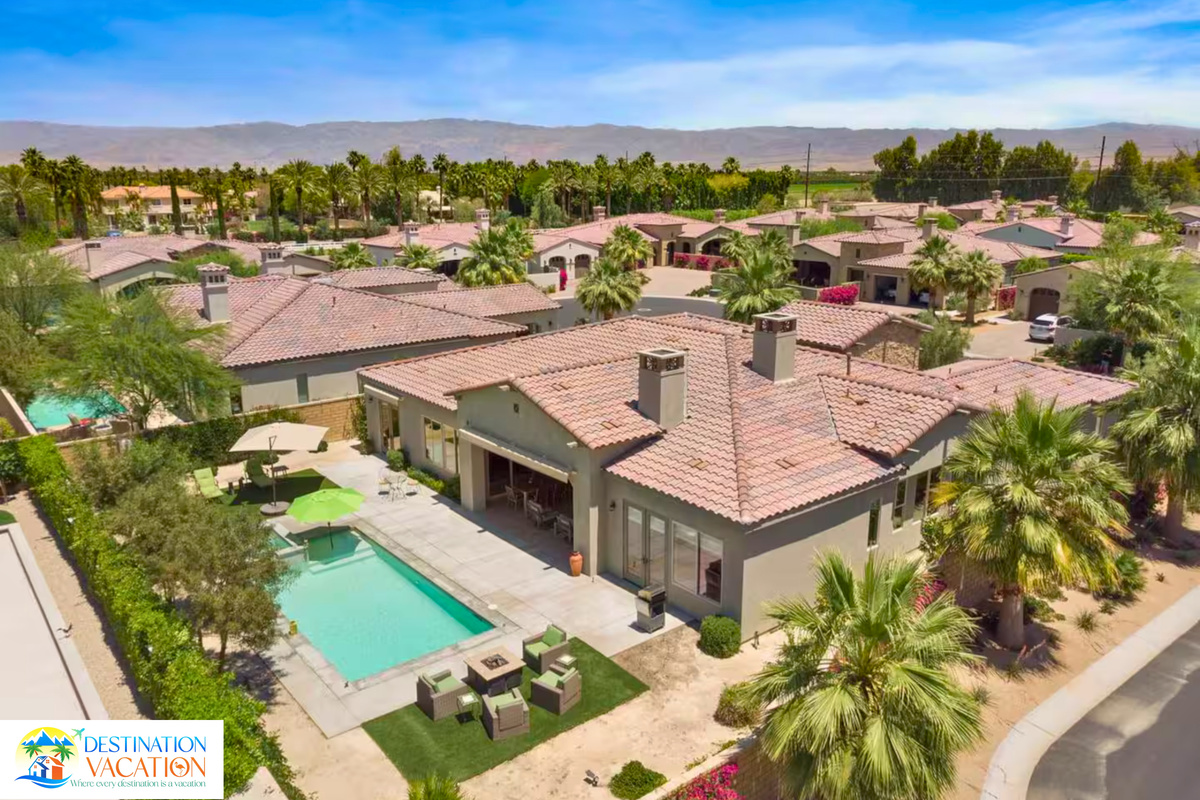 Private pool and expansive grounds shine from above.