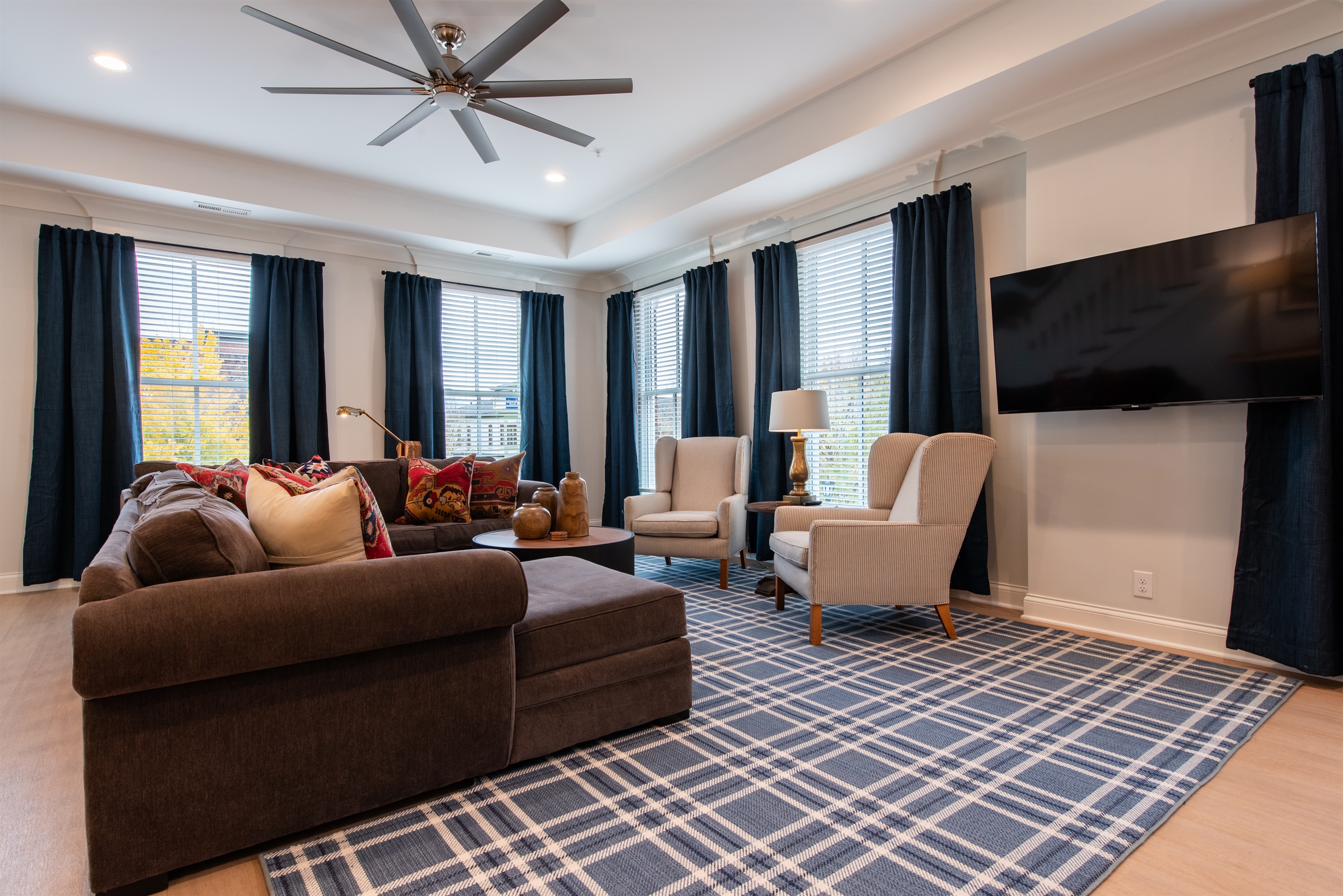 The family room includes a 55 inch TV for entertainment and gathering with friends and family.