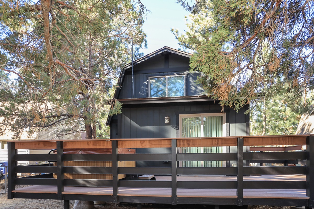 Looking at the back deck / jacuzzi from the backyard.