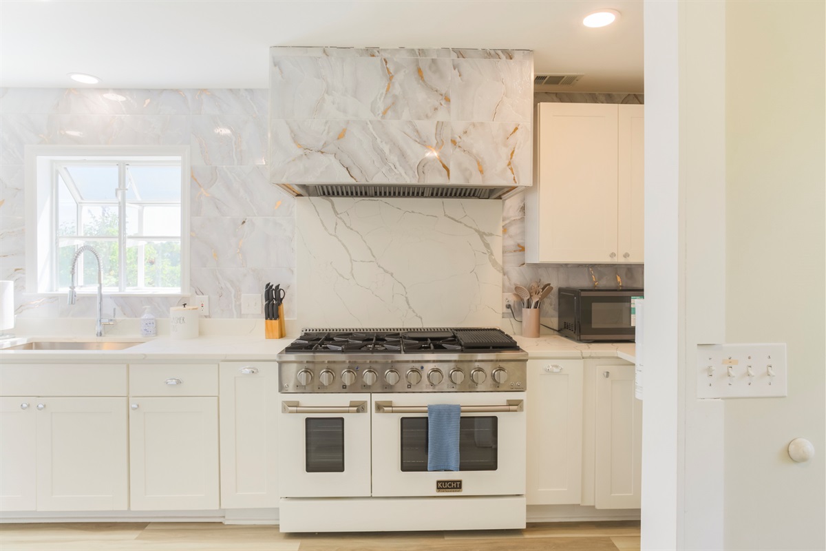 Cook like a pro on the 48” gas range with dual ovens — perfect for family meals.
