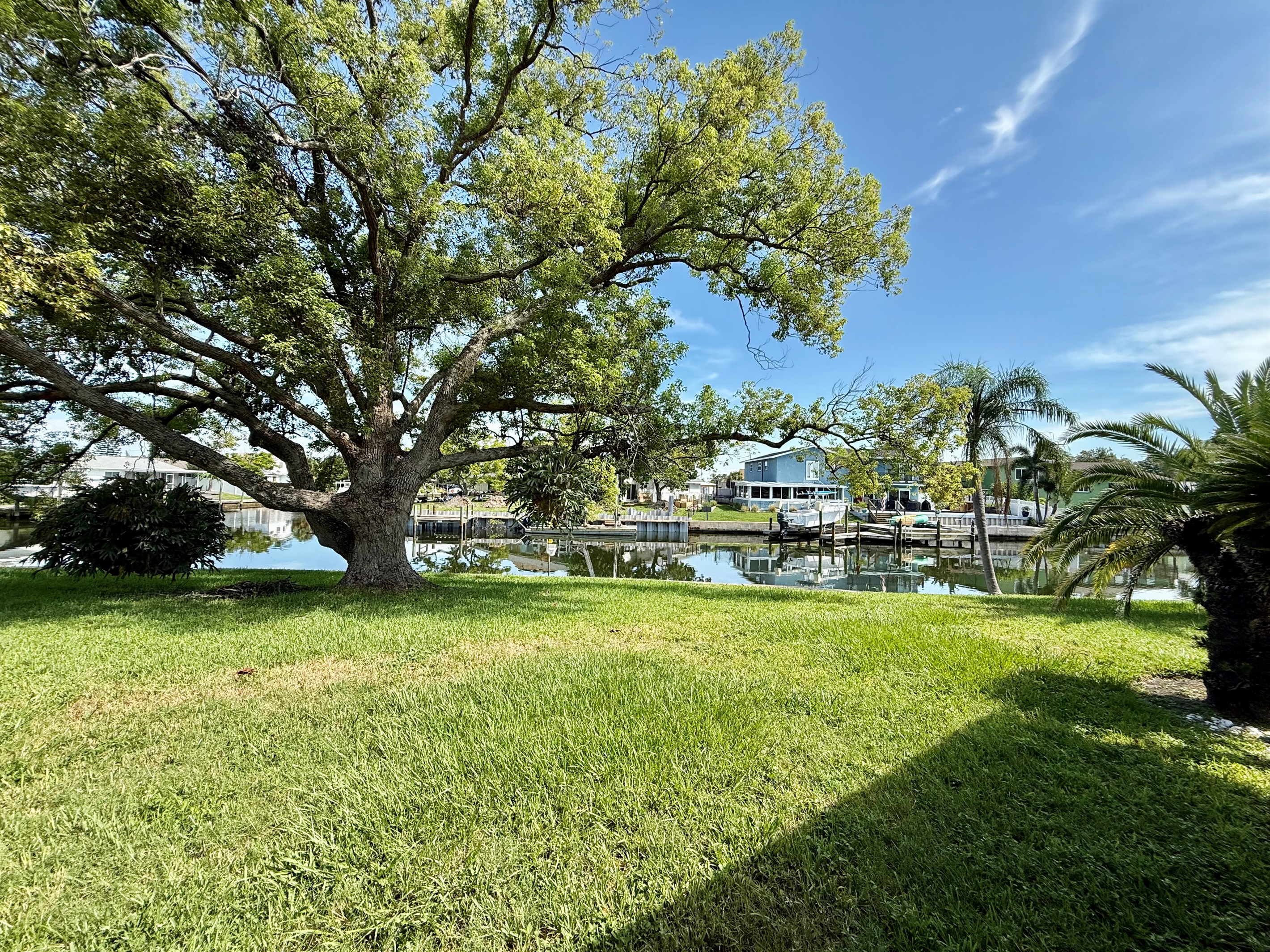 This expansive grassy lawn offers plenty of room to run, play, picnic, or stretch out under a shady tree—all with serene water views at your doorstep.