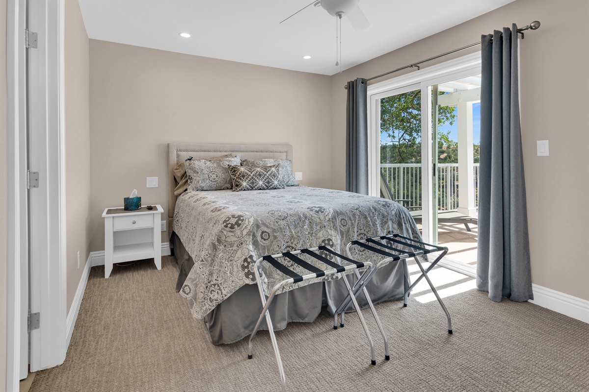 Another bedroom with queen bed, balcony and en suite bath