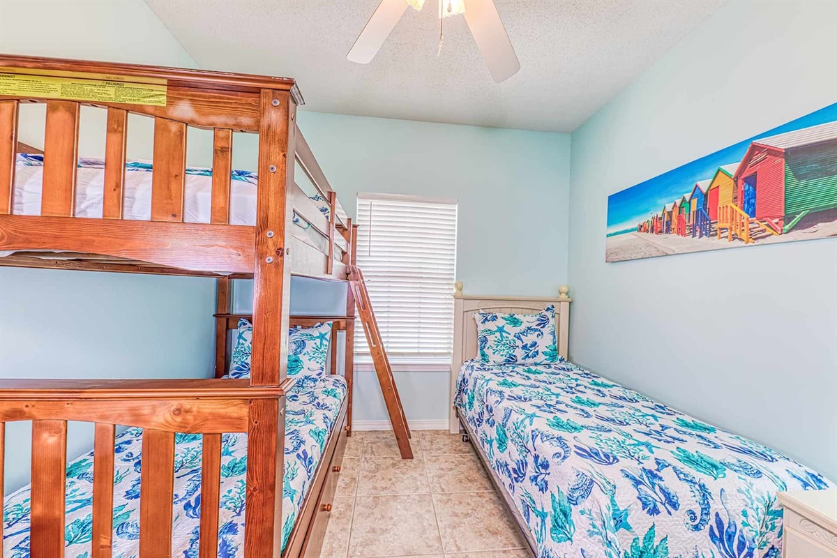Bunk Room: Fun-filled space with playful decor and colorful beach vibes perfect for kids!