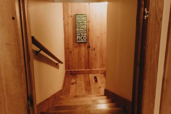 Stairs going down to the family room / game room and bedrooms 3 and 5