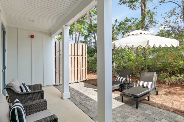 Escape to your own private backyard retreat featuring 2 swivel rockers, 2 chaise loungers, and a spacious covered patio—the perfect place to sip your morning coffee, read a book, relax, or unwind after a day at the beach.
