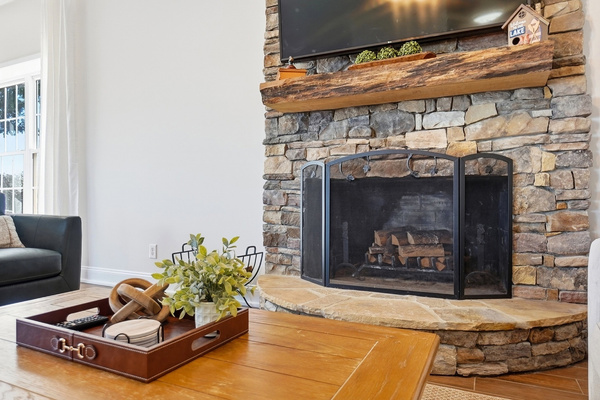 The beautiful stone fireplace adds so much character to the main living space and gives it that cozy lake-house feel.