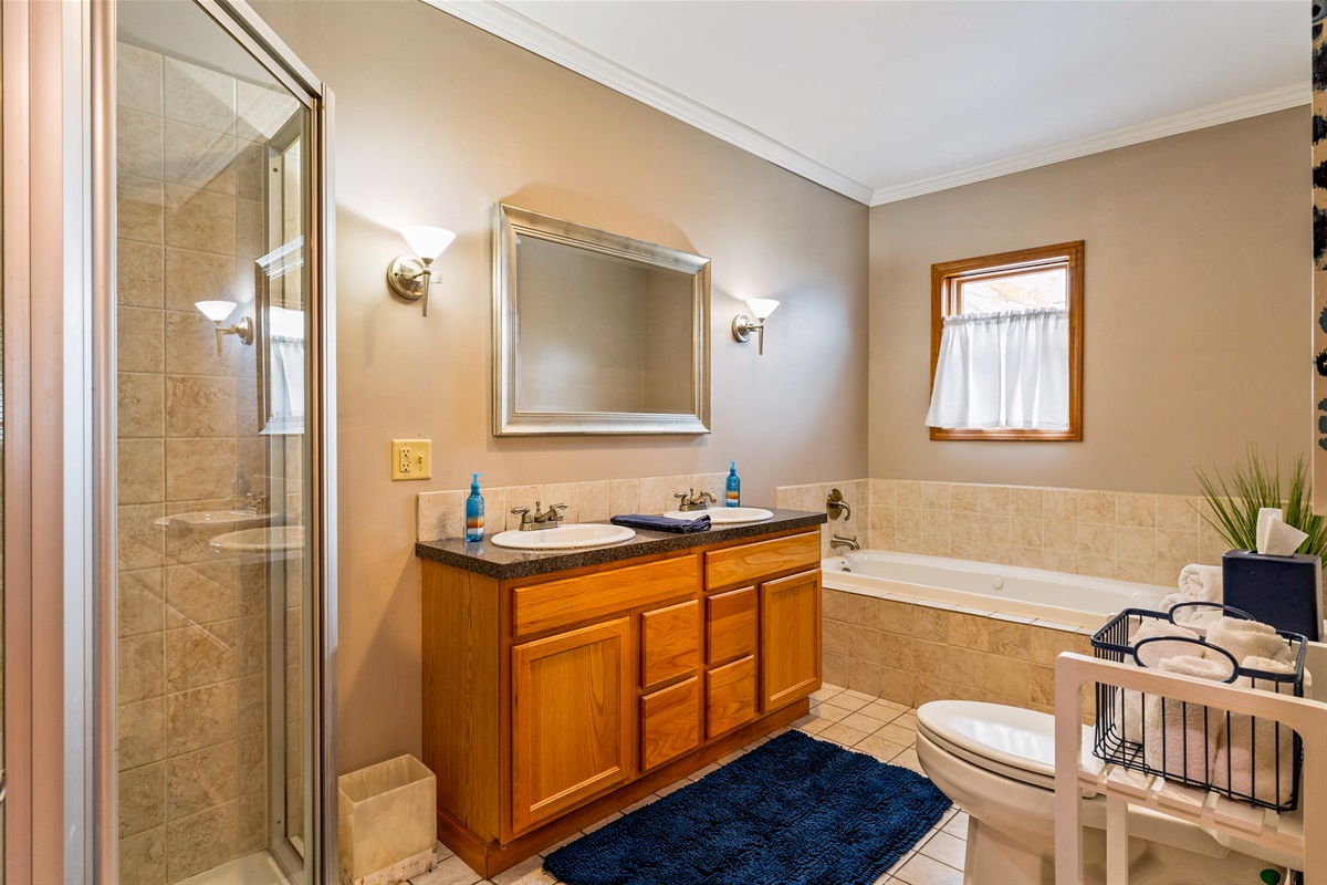 Master bathroom with jet tub and walk in shower