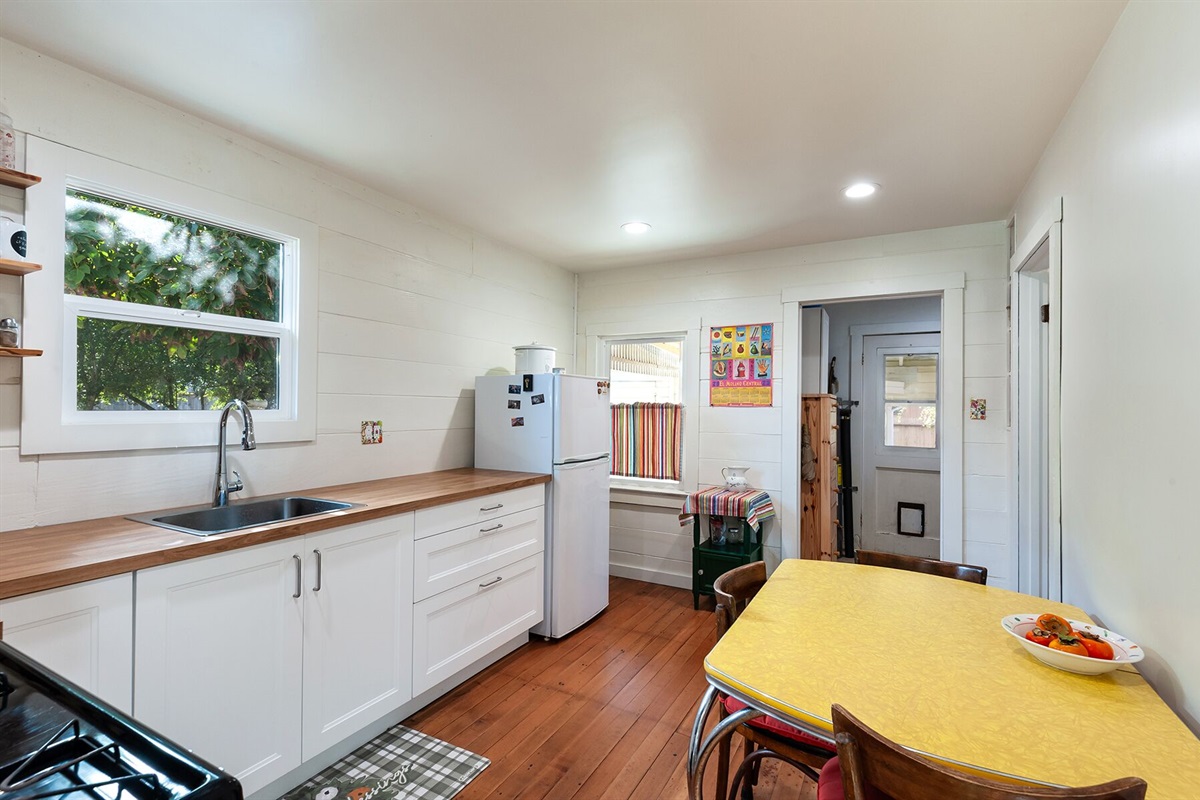 Kitchen - washer/dryer is located inside near the back door.