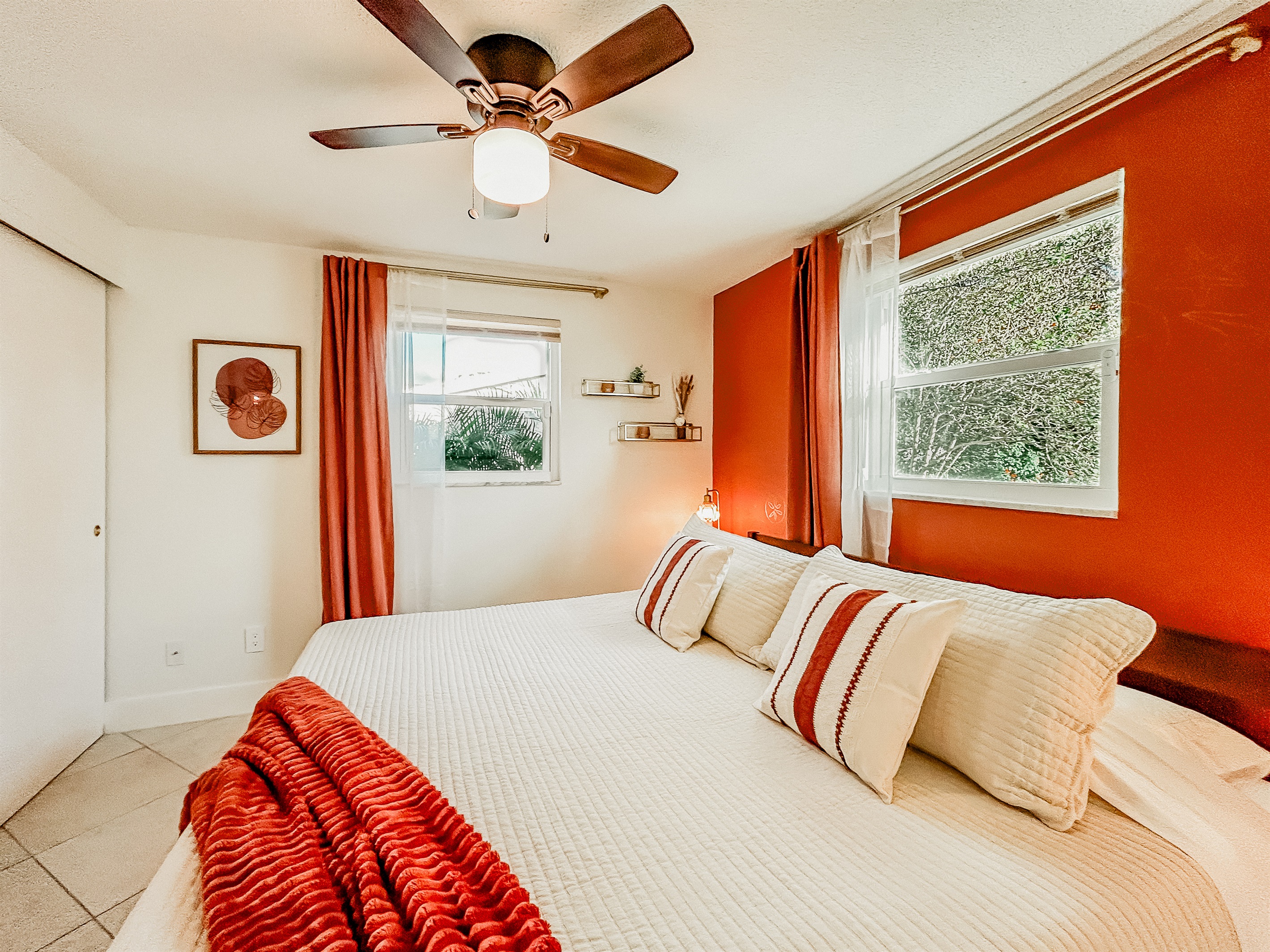 Master Bedroom with King Size Bed, Night Stands, Lamps/charging ports, Local Artist Mural, 4 King Sized Pillows, Mirror, Table Top Fan for White Noise, Iron, Ironing Board, Luggage Rack & More