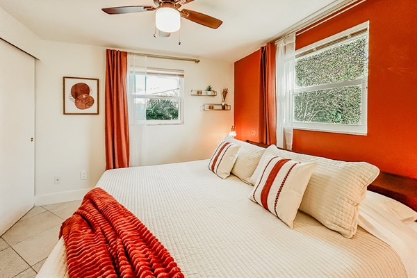 Master Bedroom with King Size Bed, Night Stands, Lamps/charging ports, Local Artist Mural, 4 King Sized Pillows, Mirror, Table Top Fan for White Noise, Iron, Ironing Board, Luggage Rack & More