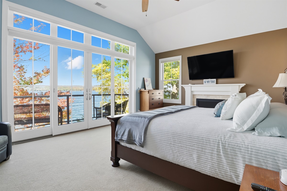 Cozy second floor king master bedroom with ensuite bathroom, private balcony, fireplace and flat-screen TV. Bedroom #1