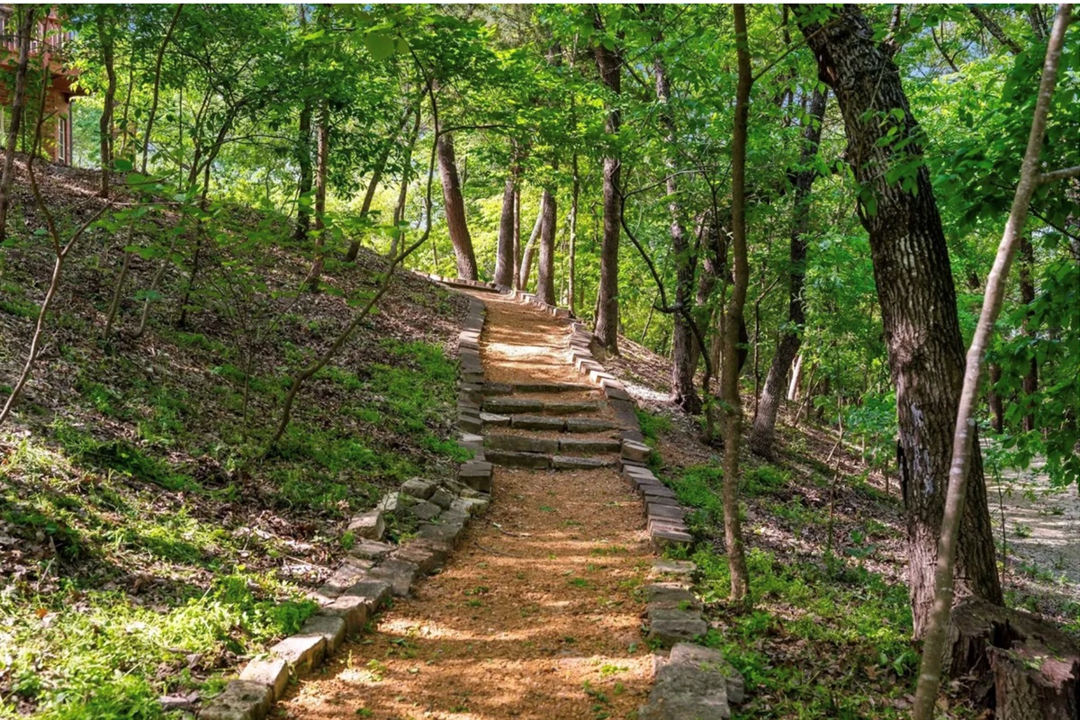 Expansive acreage offering privacy, walking trails, and space to gather.