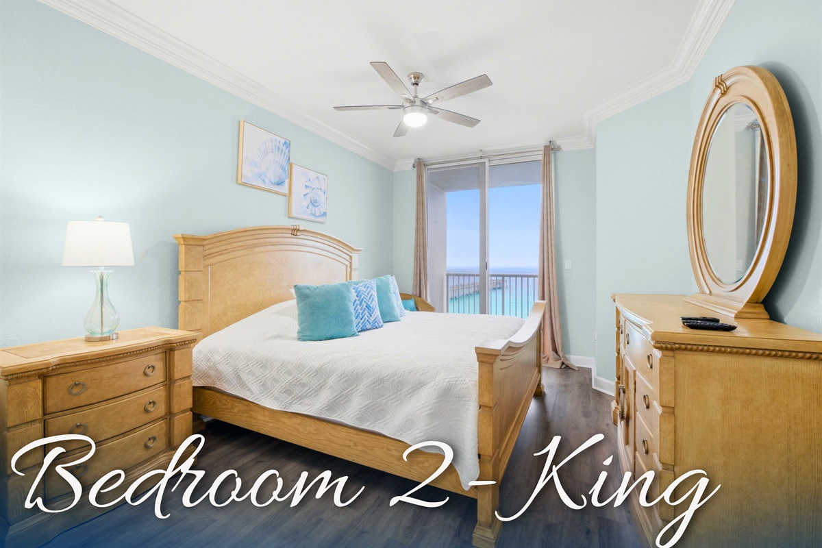 Bedroom 2 provides a cozy retreat with warm wood furnishings and inviting natural light.