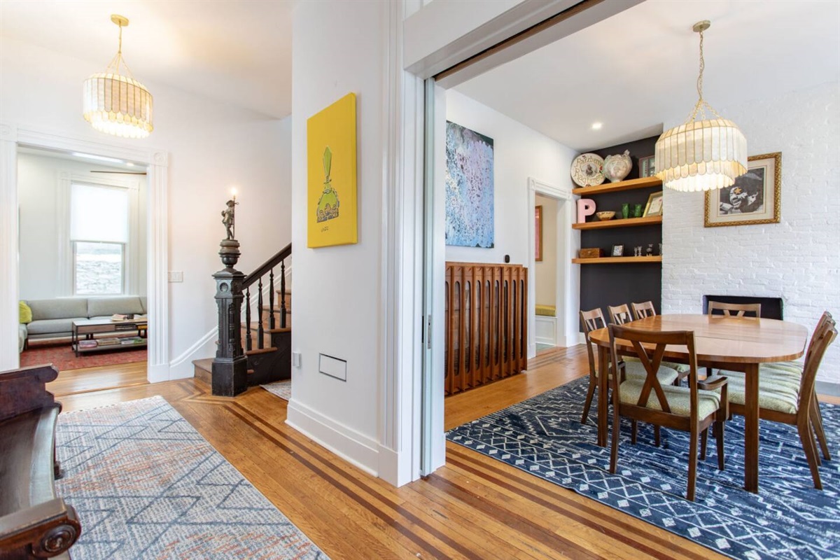A clear view of the dining area from the entrance door, with a welcoming and open layout that creates an inviting first impression of the space.