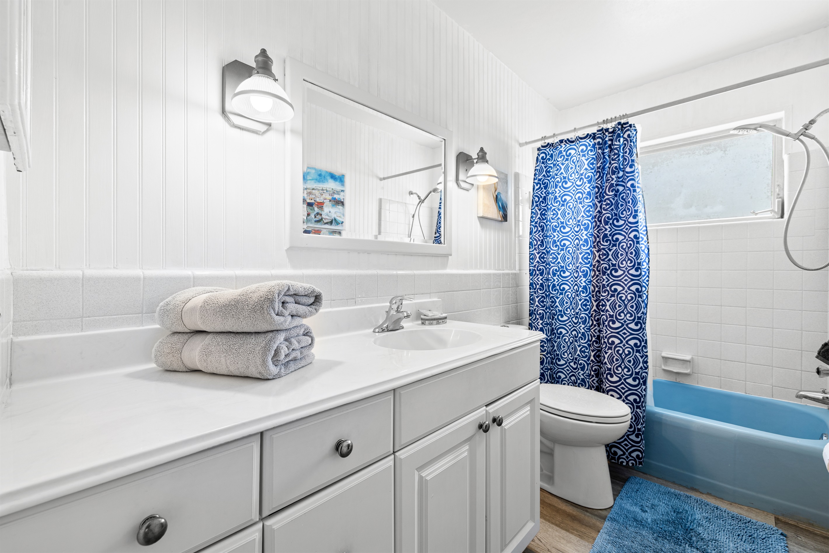 Shared bath with shampoo, conditioner, body wash and hair dryer