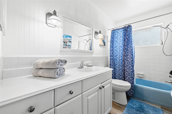 Shared bath with shampoo, conditioner, body wash and hair dryer