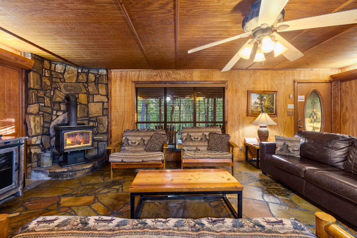 Stone fireplace adds charm to your relaxing evenings.