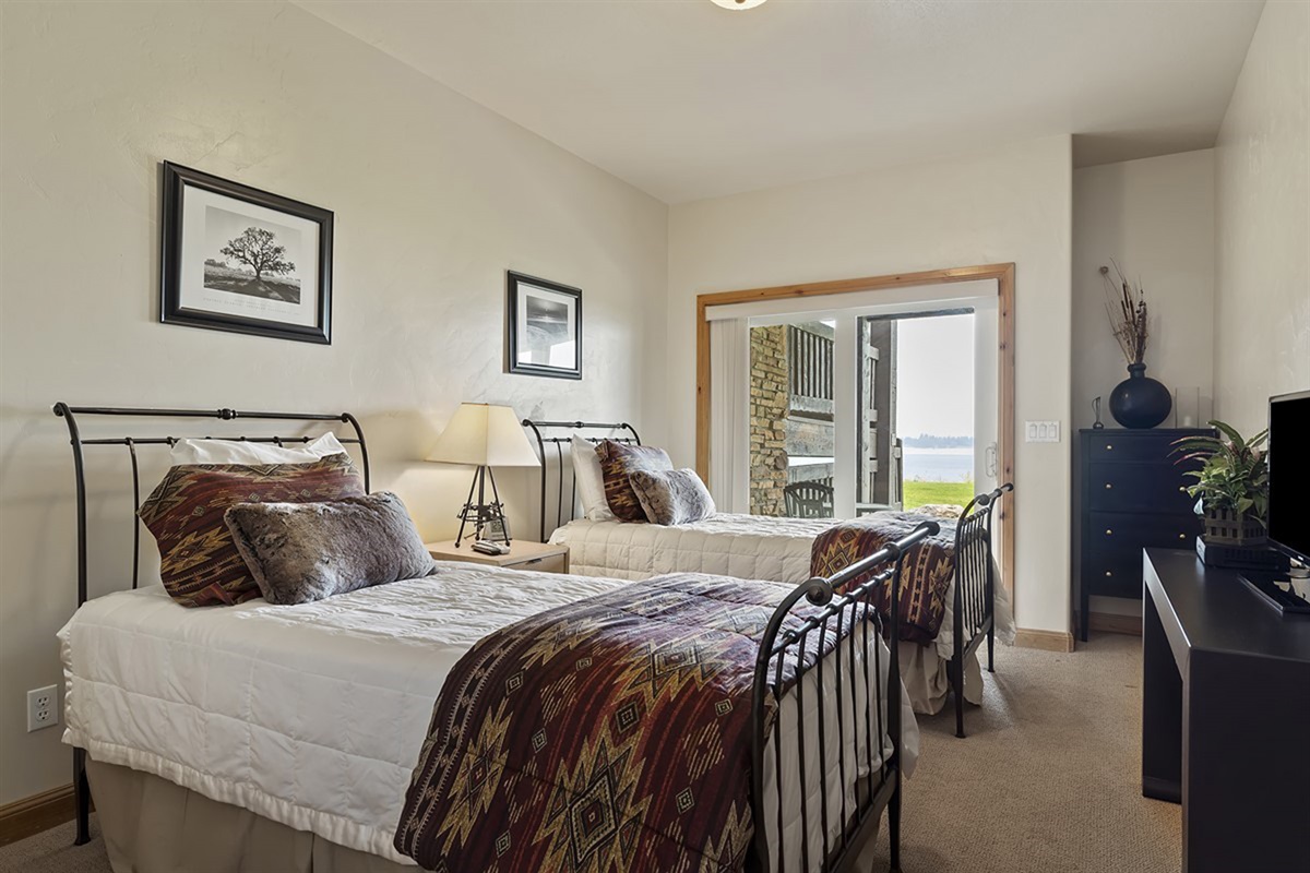 Cozy bedroom retreat with inviting textures and warm tones, designed for comfort after a day of adventure.