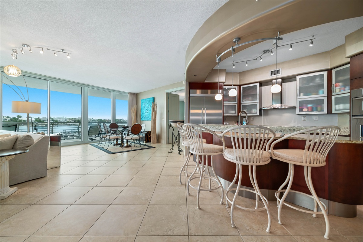 Imagine yourself in this high-end luxury condo, where the open layout flows effortlessly from the well-equipped kitchen to the spacious living and dining areas, all while being just a stroll away from Flora-Bama.