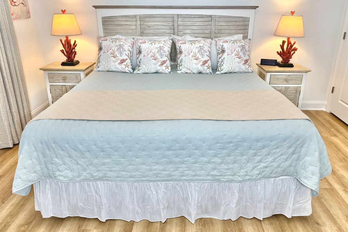 The primary bedroom has a King bed, smart TV, blackout curtains, and water view.