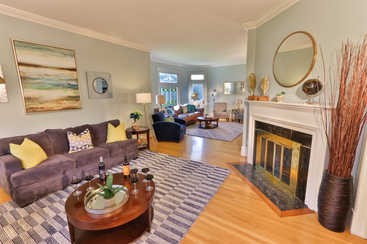 Great room with a wood burning fireplace (firewood provided)  perfect for lounging, and a pull-out couch for flexible sleeping arrangements.