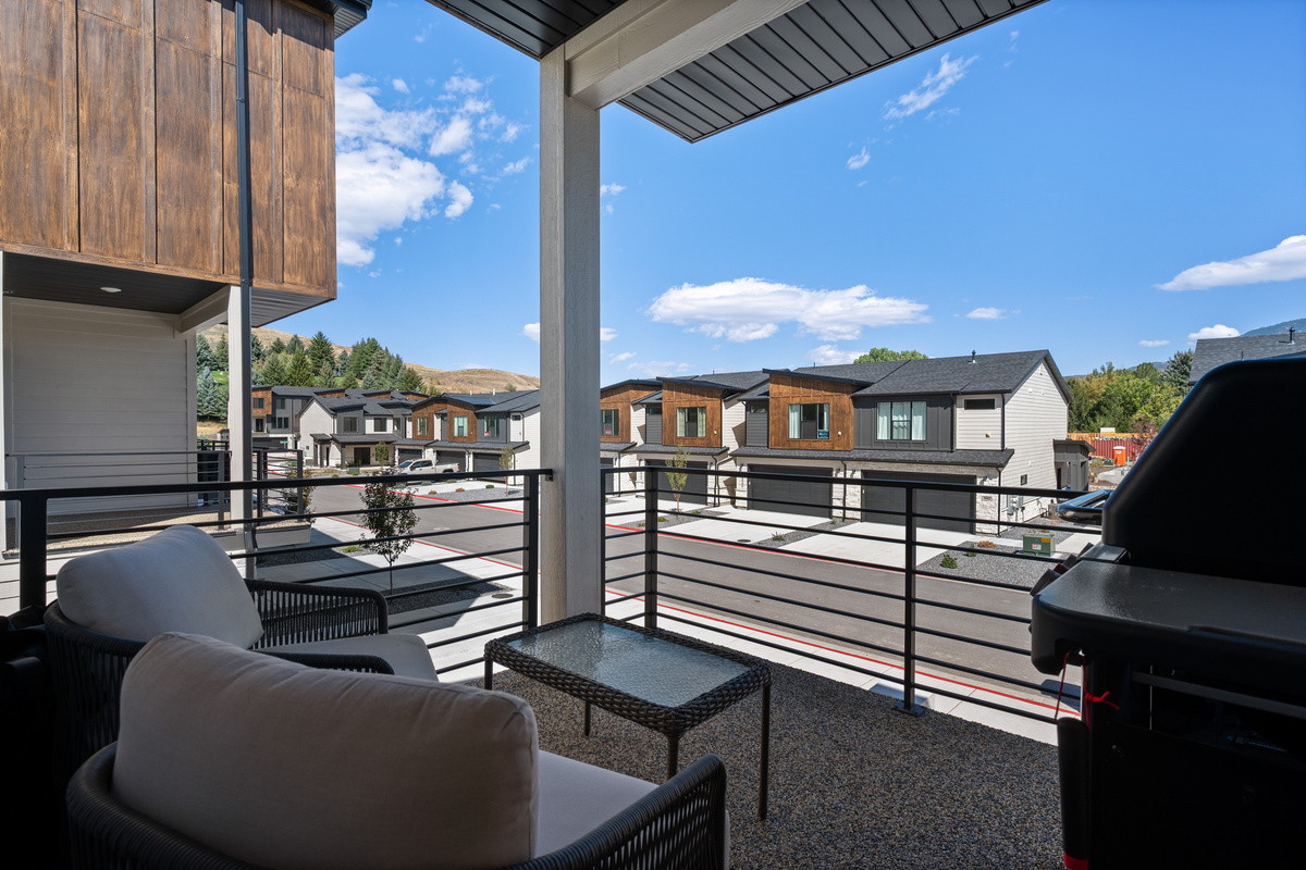 Step onto the private balcony for fresh mountain air, outdoor seating, and an easy place to relax outside.