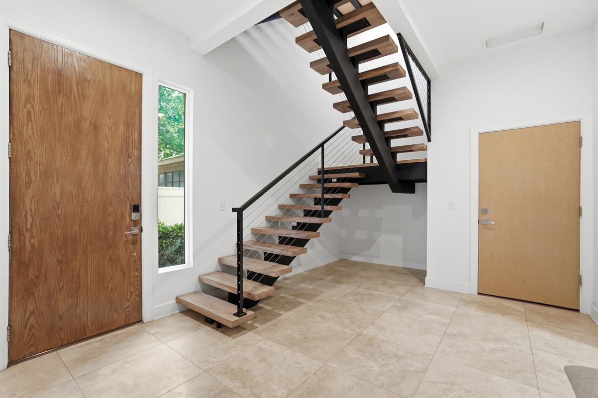 Entrance to the home and modern staircase