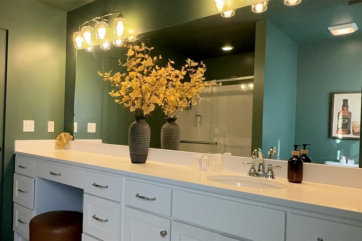 Every detail tells a quiet story of care — from the tailored lighting and deep green tones to the spacious vanity designed for both reflection and ease. A private sanctuary where daily rituals unfold with intention, calm, and understated luxury.