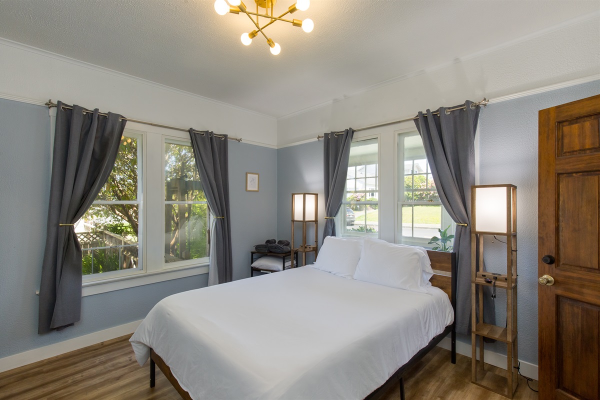 Bedroom 1 with queen bed and warm Victorian decor