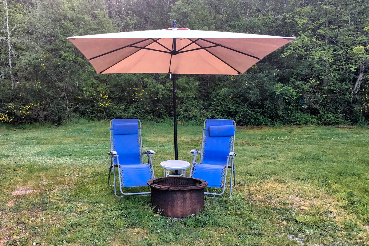 The outside Wood Fire Pit lounging area