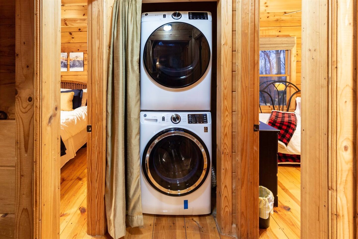 Guest washer and dryer adjacent to main floor bedrooms. A few washing pods and fabric sheets are provided to help with first few loads of laundry.