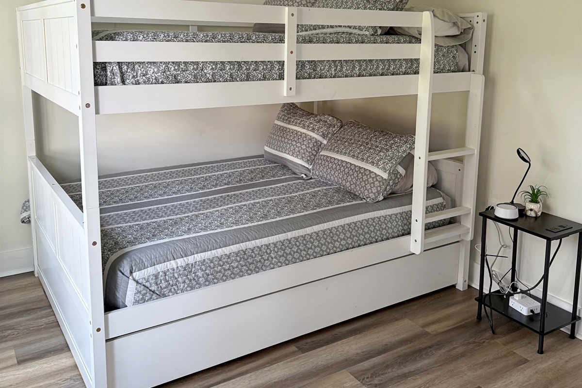 The third bedroom has a set of full-size bunk beds.