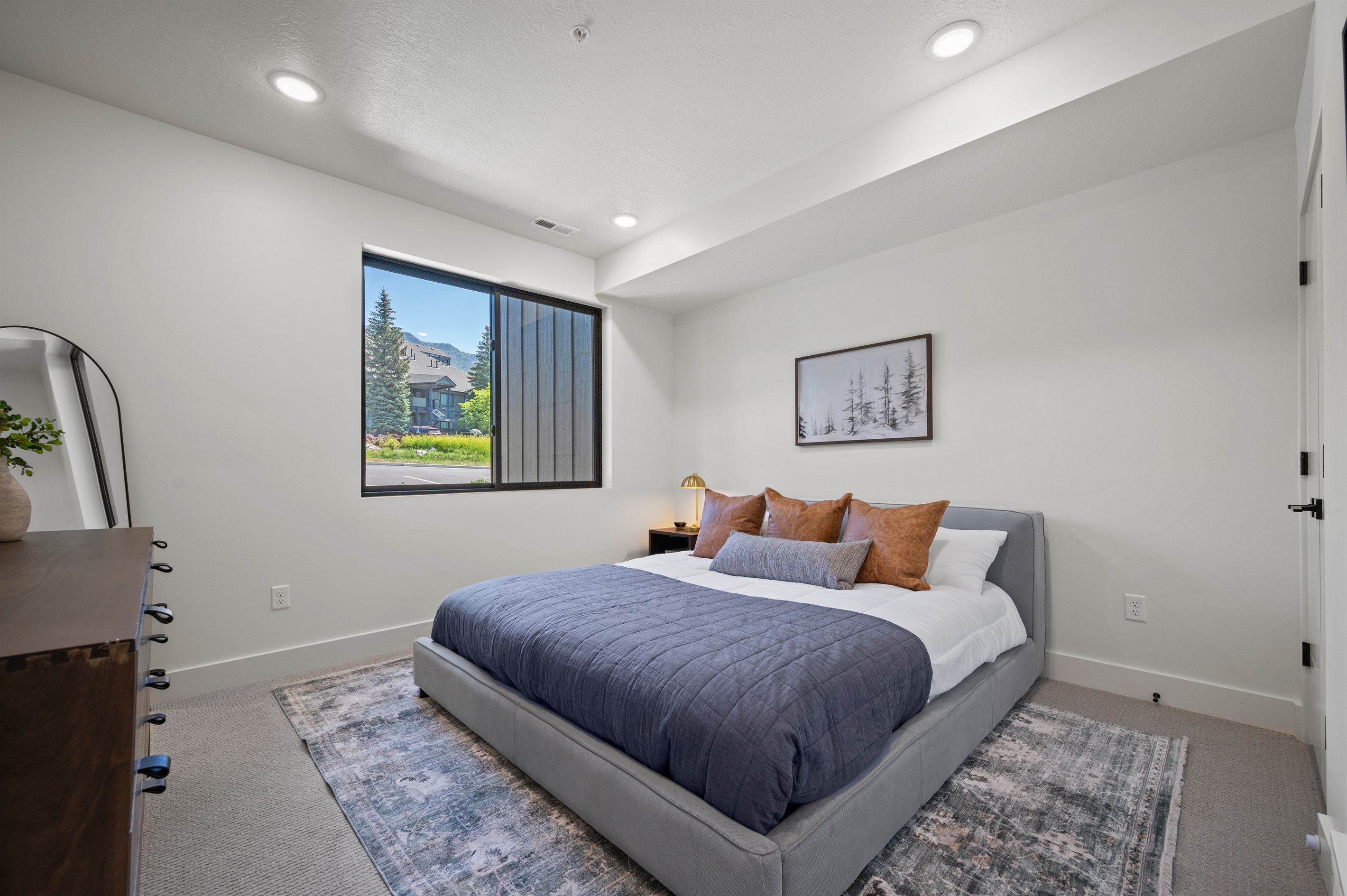 The primary bedroom is light and airy.