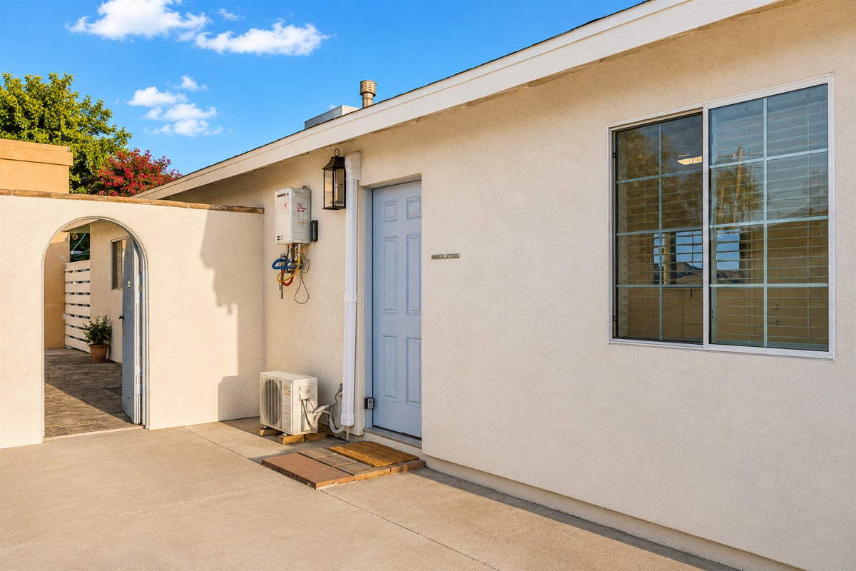 The access to this studio is through this door on the right side of the house, just before entering the arched door to the oasis back yard.