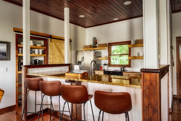 Bright kitchen with everything you need plus bar seating for casual meals