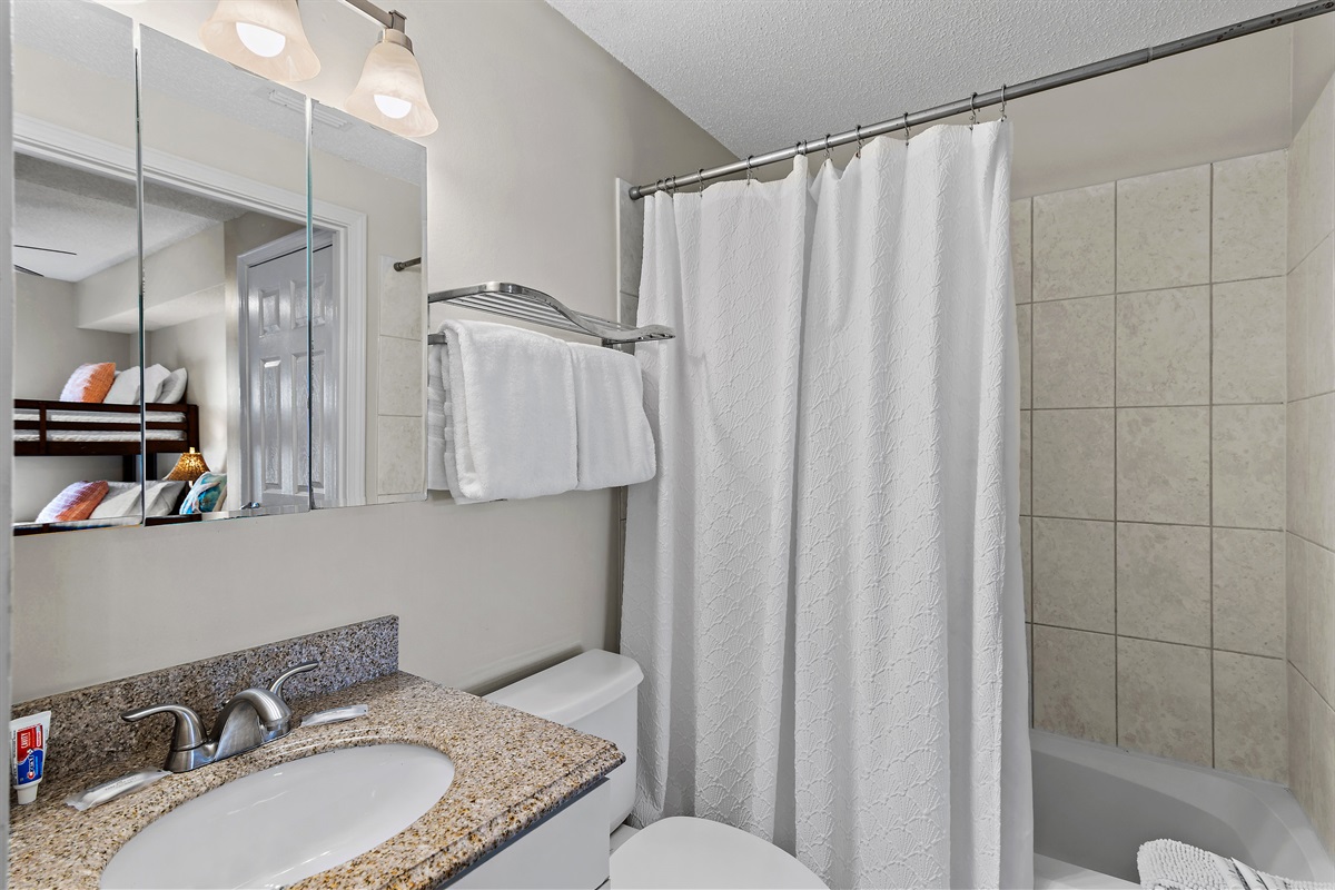 Guest Bedroom: Queen Bed, Twin Bunk Beds, Private Bathroom with Shower/Tub combo (sleeps 4)