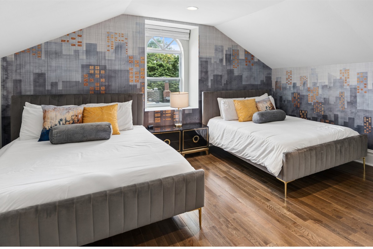 Perfect for groups, this spacious third-floor retreat features two queen beds and plenty of room to spread out.
