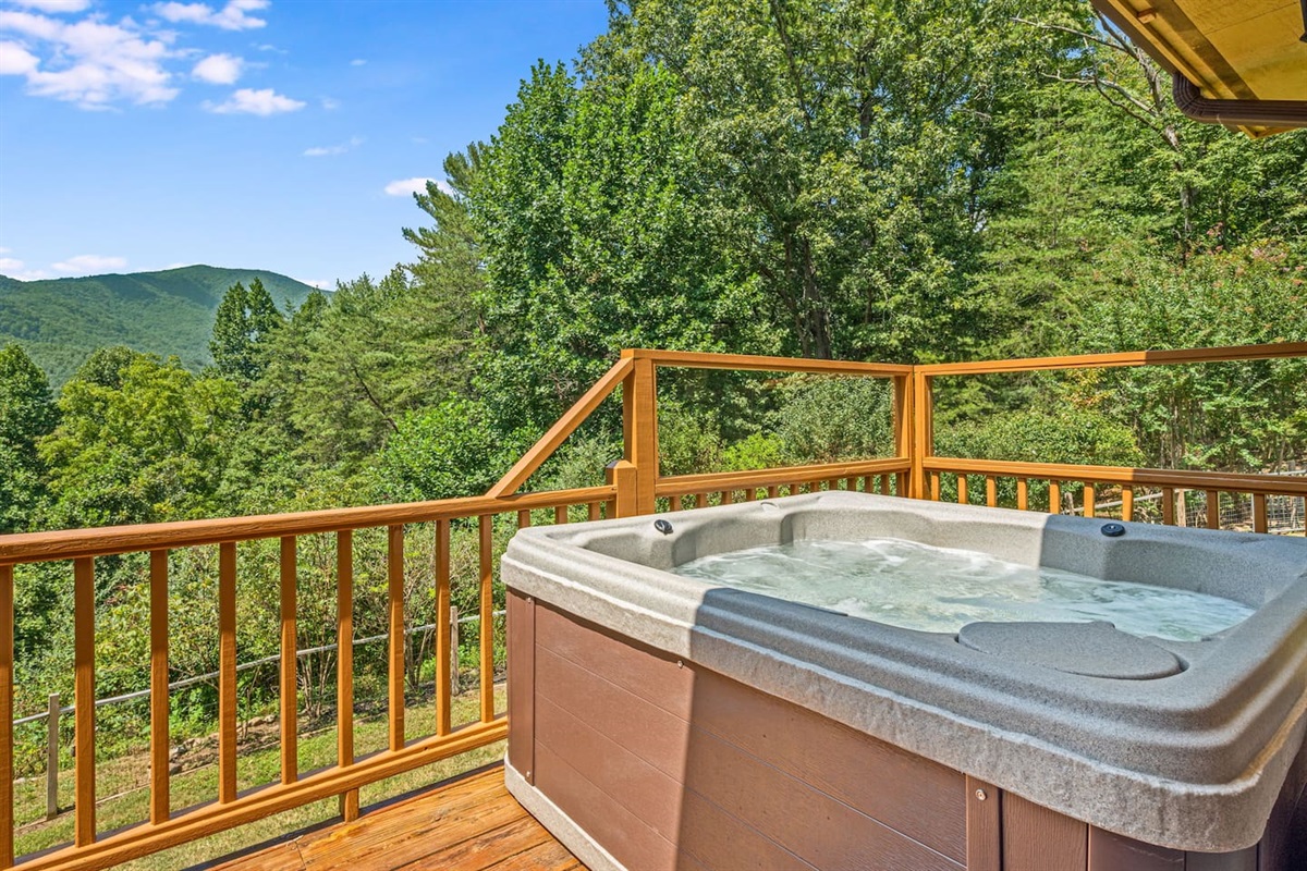 Rest up after a day's adventures with a soak in the hot tub overlooking the mountains.