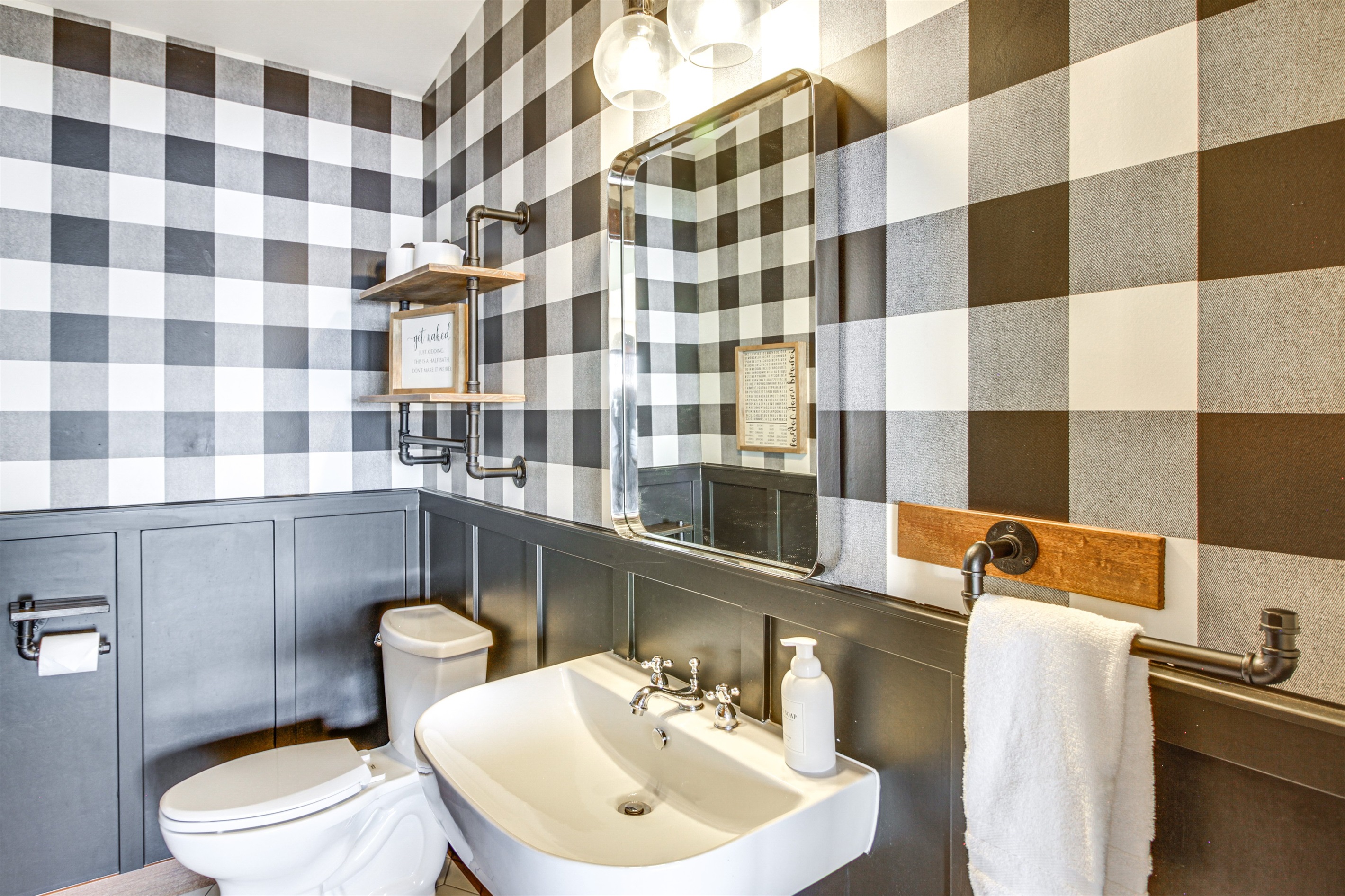 Main-level half bathroom with modern fixtures