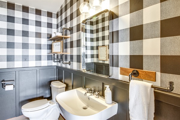 Main-level half bathroom with modern fixtures