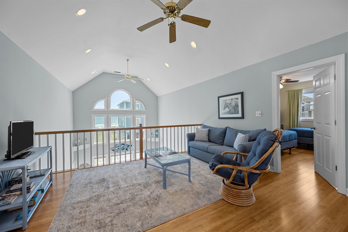 Spacious loft area with cozy sectional sofa