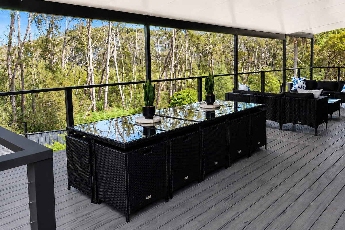 A view across the upper back deck at Skye’s Beach House Malua Bay, looking out to the natural backdrop behind the property.