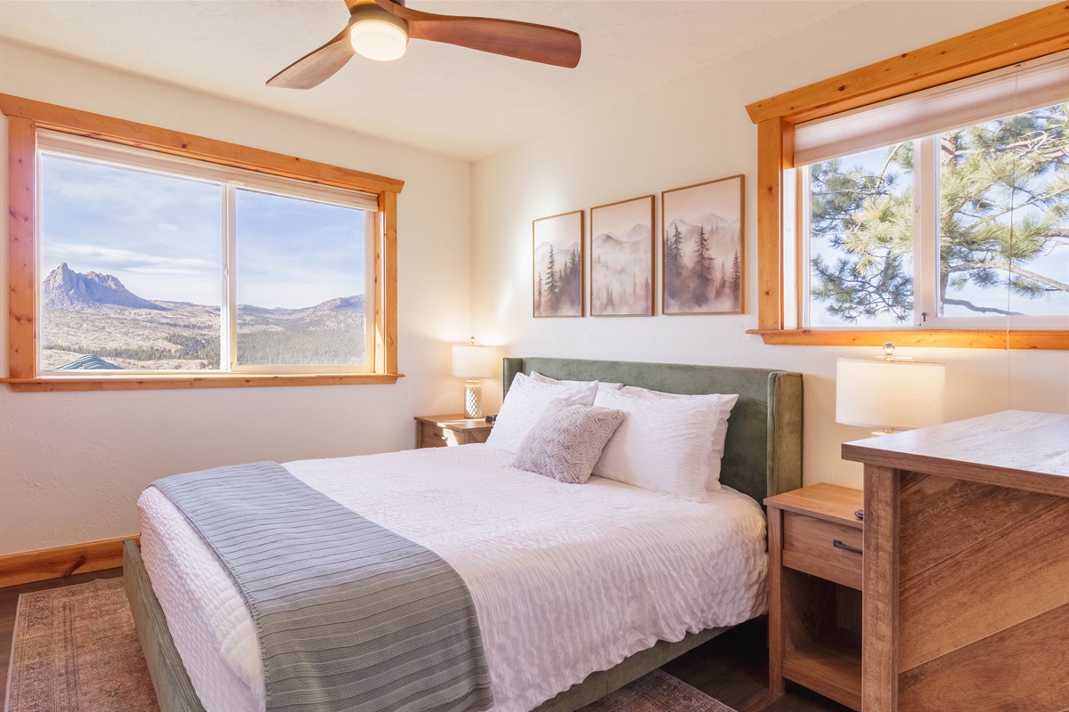 Secondary bedroom features a queen sized bed and offers stunning views of Sheep's Nose