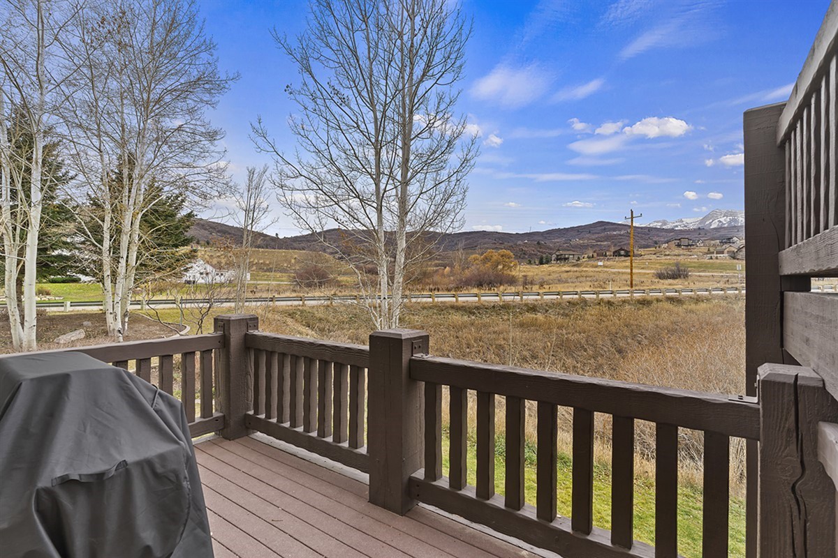 Enjoy outdoor grilling on the private deck, where scenic views create the perfect backdrop for al fresco dining.